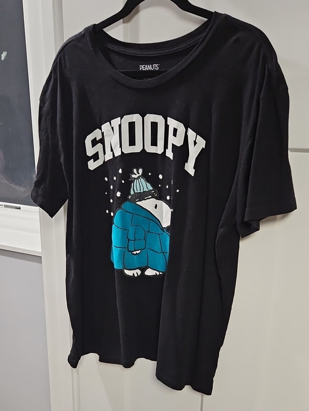 Peanuts Black Tee with Teal Snoopy Puffer Graphic